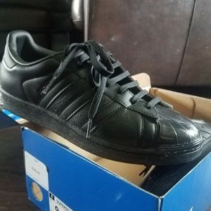 solid black Adidas shell toe